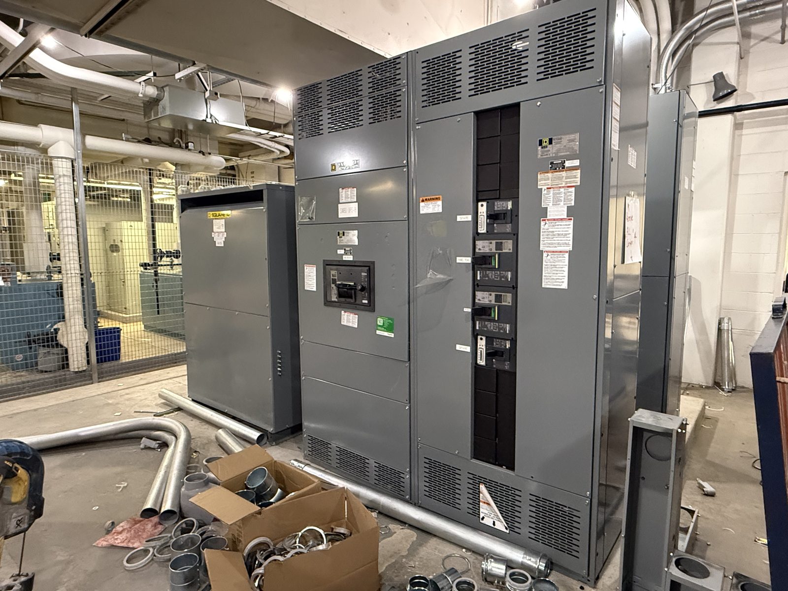 Square D switchboard lineup and dry-type transformer installed in an industrial mechanical room